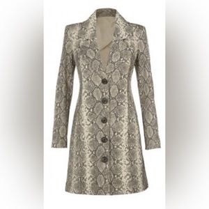 CABi medium jacket falls above the knees. Flattering cut and style.